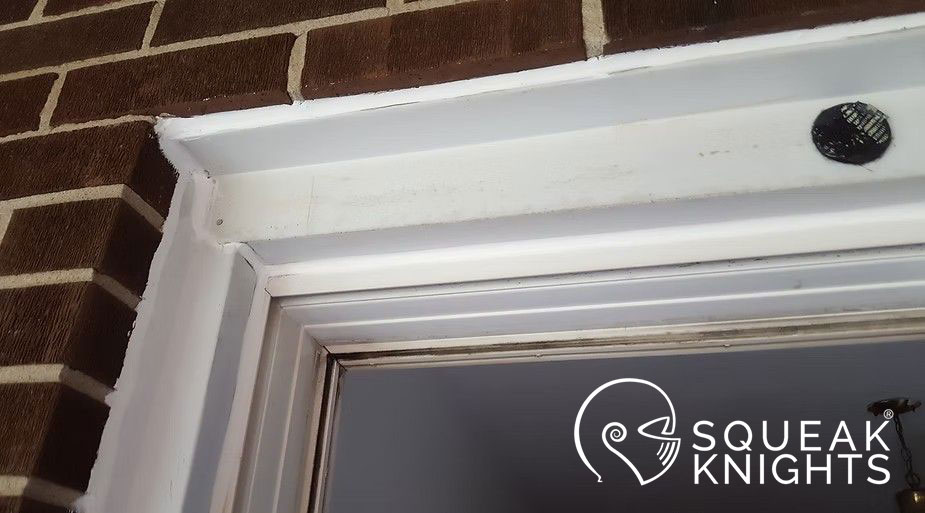 Resealed caulking shown between window and flashing and between flashing and brick