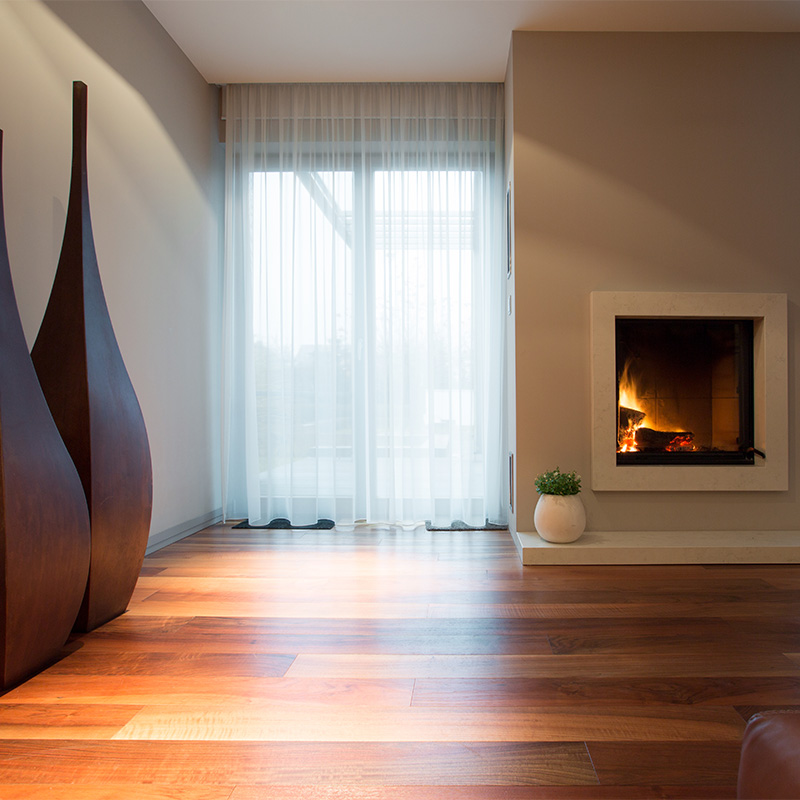 Burning fireplace and designed decoration in living room